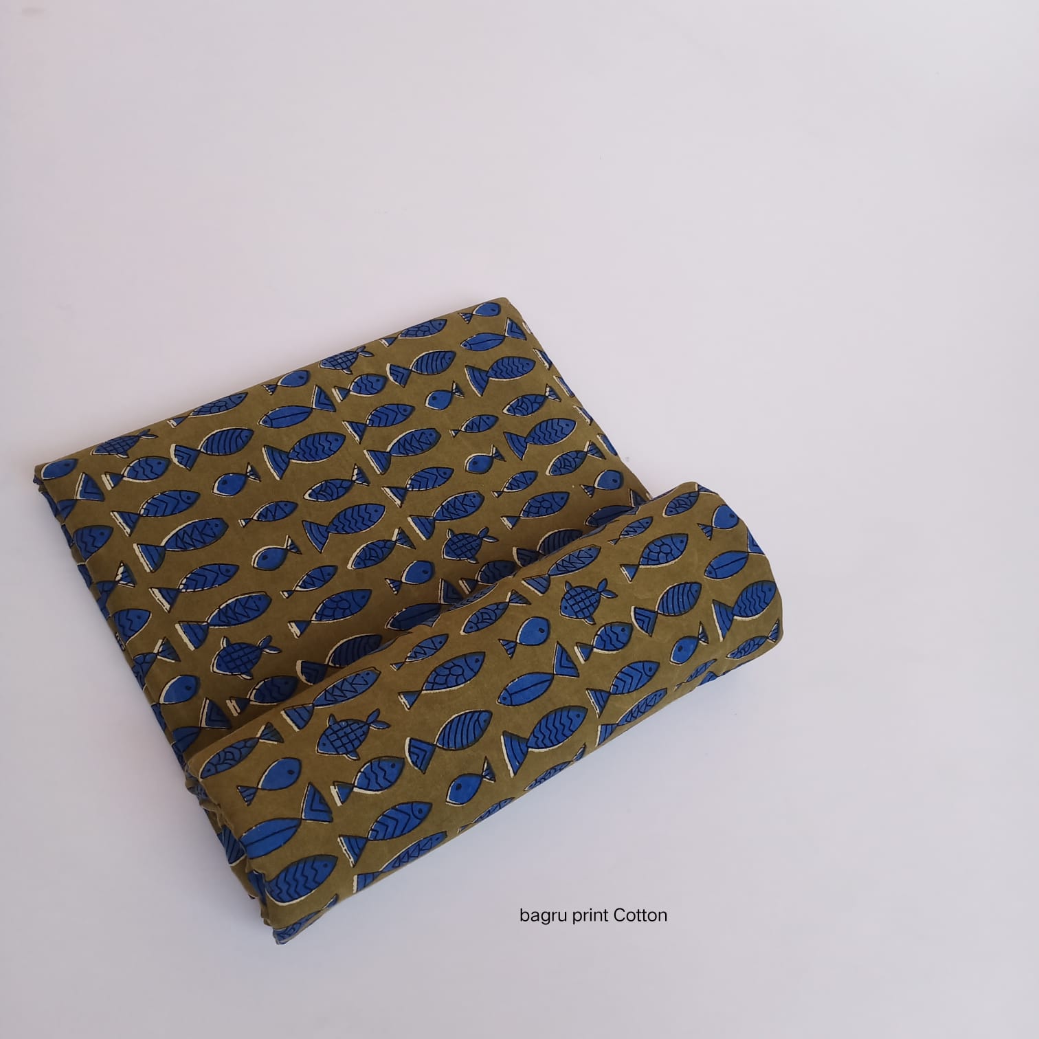 Olive tone Bagru handblock printed cotton fabric with traditional fish motif, artisan-crafted wholesale by Fabtexs